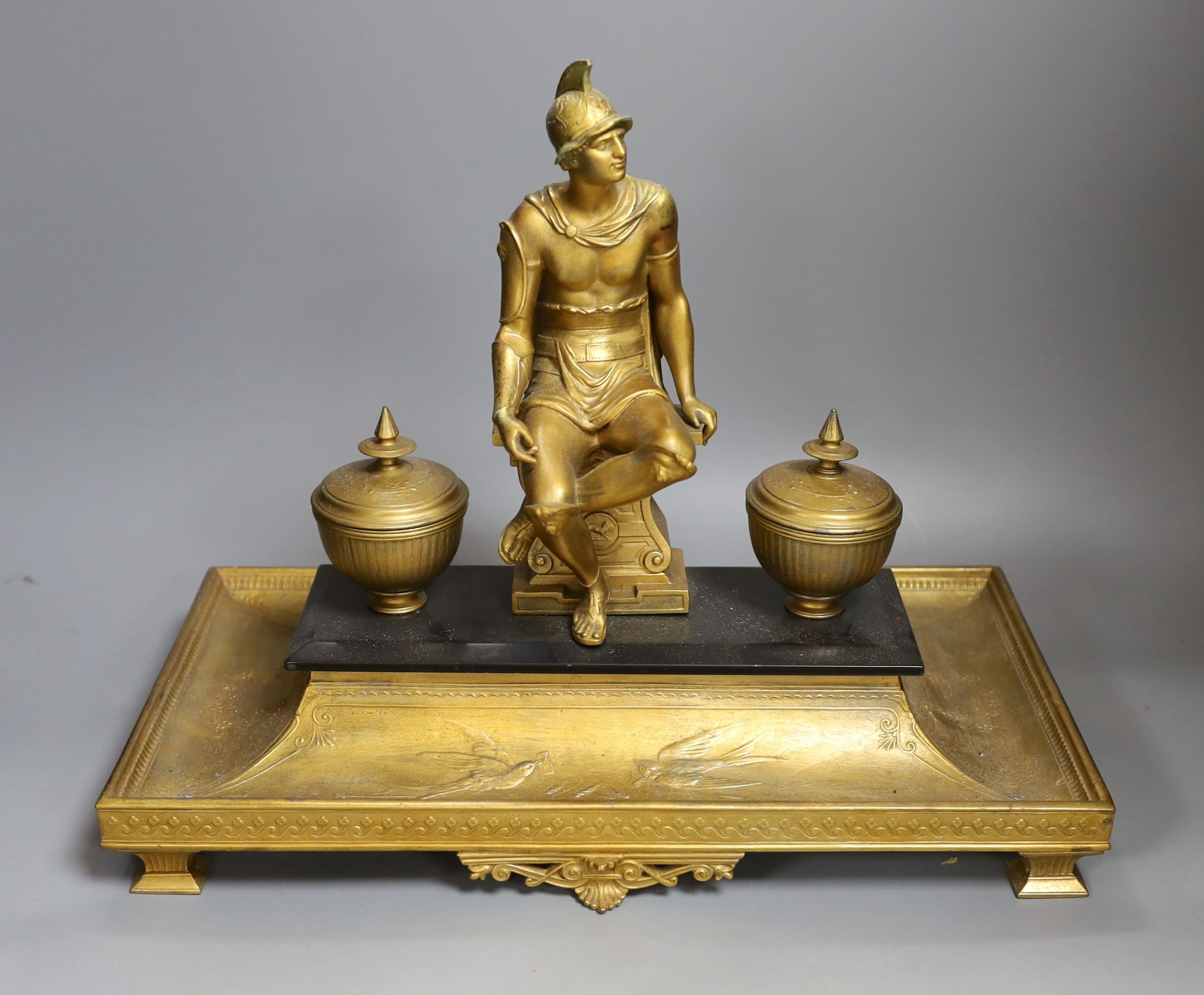 A decorative gilt inkstand depicting a Roman gladiator - 33cm tall